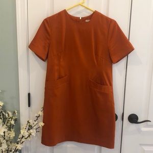Orange shift dress.